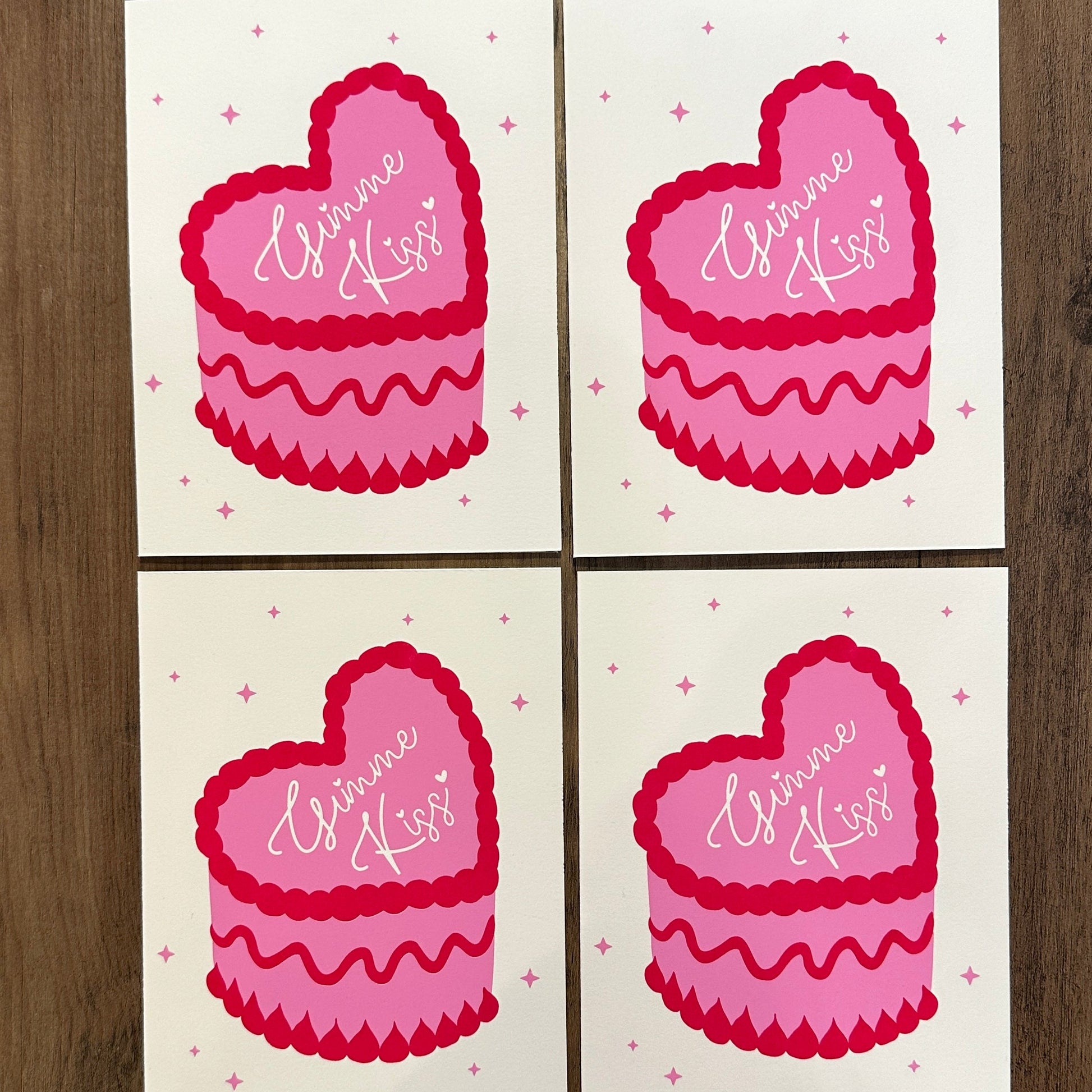 Four pink heart-shaped stickers with 'Gimme Kiss' text on a white background.